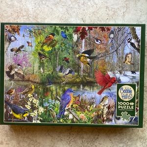BEAUTIFUL COBBLE HILL PUZZLE. PUT TOGETHER 1X. IT IS A BLEND OF ALL 4 SEASONS.